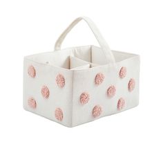 a white bag with pink polka dots on it