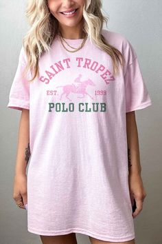 SAINT TROPEZ POLO CLUB OVERSIZED GRAPHIC TEE / T-SHIRTPREMIUM COTTONOVERSIZED FIT Sporty Polo Collar T-shirt For Summer, Summer Polo Collar T-shirt With Graphic Print, Casual Polo Collar T-shirt With Graphic Print, Preppy Graphic Print Crew Neck Top, Preppy Crew Neck Top With Graphic Print, Summer Crew Neck Polo Shirt For Streetwear, Sporty Short Sleeve Polo Shirt With Letter Print, Casual Crew Neck Polo Shirt With Letter Print, Sporty Pink Polo Collar Top