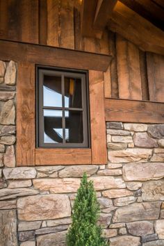 a window on the side of a stone building