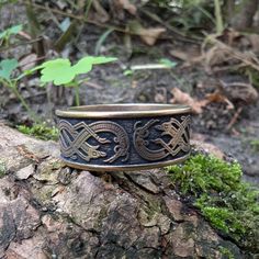 Embrace the timeless elegance of ancient Viking craftsmanship with the Jelling Band Ring, inspired by the intricate patterns found on the historic Jelling Stones in Denmark. This stunning ring is a perfect blend of Norse heritage and modern style, making it an ideal choice for a Norse wedding band or a Viking engagement ring. The detailed Nordic knotwork design, symbolic of unity and eternity, makes this ring a meaningful expression of love and commitment. Crafted with care, this Viking ring is Nordic Knotwork, Viking Wedding Band, Norse Wedding, Viking Wedding Ring, Nordic Jewelry, Viking Wedding, Norse Jewelry, Ancient Vikings, Viking Ring