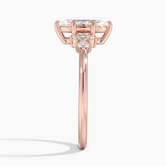 Marquise Cut Miroir Diamond Engagement Ring - 14K Rose Gold. Round and marquise diamonds are reflected on either side of the center stone in this unique five stone ring with a modern yet traditional feel (1/6 total carat weight). 
 
 The Reflections Collection, a line of exclusive Brilliant Earth designs, features dynamic jewelry united by motifs that reflect the symmetry of mirroring images found in nature. Classic Three-stone Rose Gold Jewelry, Classic Three Stone Rose Gold Jewelry, Classic Rose Gold Three-stone Jewelry, Elegant Rose Gold Three Stone Ring, Marquise Diamond Rose Gold Ring, Marquise Rose Gold Diamond Ring With Center Stone, Rose Gold Marquise Diamond Ring With Center Stone, Formal Rose Gold Three Stone Jewelry, Luxury Marquise Cut Rose Gold Wedding Ring