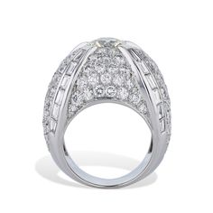 This 18kt White gold French Hallmark Dome Ring is truly breathtaking with its Old European Cut Diamond, plus an awe-inspiring 122pcs of Pave Diamonds and an impressive 24pcs of Baguette Diamonds - all together, this stunning Ring amounts to an eye-catching 6.87ct TW! An Estate Ring of a perfect Size 6. White gold French Hallmark Dome Ring 18kt. White gold Approx. 6.87ct TW Diamonds 1pc Old European Cut Diamond - 1.49ct K-L VS2 ( 7.45x7.43x4.43mm) 122pcs Approx. 4.95ct RBC F/G VS 24pcs Approx 1.9 Estate Ring, Estate Rings, Dome Ring, Baguette Diamonds, Store Hours, European Cut Diamonds, Domed Ring, Baguette Diamond, Diamond Sizes