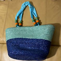 New Without Tags Straw Beach Bag Shades Of Blue With Fabric Straps/Handles With Decorative Wood Beads. Measures Approx 12” Drop, 20” W X 8” Deep X 11” Tall. Fully Lined Inside Bag. Very Nice Straw Bag. Inside Wall Pocket, Snap Closure. Casual Blue Straw Bag For Vacation, Blue Beach Bag With Braided Handles For Vacation, Rectangular Blue Beach Bag For Summer, Casual Blue Bags For Beach Season, Casual Blue Shoulder Bag For Summer, Blue Straw Tote Bag For Beach Season, Blue Tote Straw Bag For Beach Season, Blue Rectangular Straw Bag For Vacation, Blue Straw Bag For Daily Summer Use