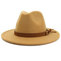 Khaki flat brim fedora hat with camel colored belt. Your outfit's best friend. Take your look to another level, with one accessory. Our fedoras are guaranteed to get you looks and compliments, honey! Cotton 65% Polyester 35% Size : adjustable Hat Circumference : 23.5" inches Hat Height : 5.25" inches Brim Circumference : 38" inches Brim Diameter : 13.65" inches FINAL SALE ON FEDORAS. NO RETURNS NOR EXCHANGES. Luxury Brown Chic Fedora, Luxury Brown Fedora For Fall, Luxury Brown Fedora With Short Brim, Luxury Brown Fedora For Everyday Wear, Chic Adjustable Brown Fedora, Adjustable Brown Fedora For Fall, Trendy Adjustable Beige Fedora, Adjustable Brown Fedora With Flat Bill, Adjustable Fedora Panama Hat For Fall