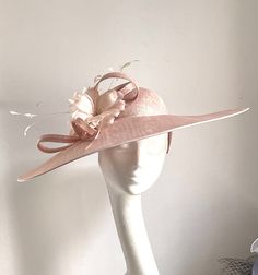 Pale pink saucer disc hat This amazing pale pink saucer disc hat is made from pink sinamay fabric. On the side are sitting matching colour feather flowers. The hat has a fabric-covered headband Pink saucer disc hat will be an amazing accessory to compliment your outfit. It will fit the average head size. You can wear this amazing hat at the wedding, Christening, Royal Ascot races, and any other special occasion. Enjoy and please have a look at my hats and fascinators in my shop  https://www.etsy Pale Pink Wedding, Pink Mother Of The Bride, Pale Pink Weddings, Royal Ascot Races, Mother Of The Bride Hats, Feather Flowers, Sinamay Fabric, Ascot Races, Royal Ascot Hats