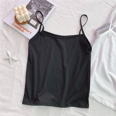 Brand Name: SusiRitaOrigin: CN(Origin)Material: COTTONMaterial: PolyesterDecoration: NONEClothing Length: SHORTAge: Ages 18-35 Years OldItem Type: TopsTops Type: CamisFabric Type: BroadclothModel Number: Crop Top WomenGender: WOMENStyle: Street StyleStreet Style: CasualPattern Type: Solid Black Summer Tank Vest, Black Camisole With Straps For Summer, Black Camisole With Built-in Bra And Wide Straps, Black Camisole Vest For Summer, Casual Spaghetti Strap Tank Top In Solid Color, Black Cami Tank Top For Summer, Casual Tank Top With Spaghetti Straps In Solid Color, Solid Color Tank Top With Tank Straps For Summer, Casual Black Camisole With Tank Straps