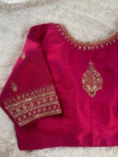 Hand embroidered ready made saree blouse / crop top/stitched saree blouse usa / pink saree blouse/modern blouse/zardosi blouse/red elbow sleeve saree blouse/ pure silk blouse/ maggam work blouse        It is very true that a perfect blouse is the one which makes your saree look stand out !! If you find one of such a style that you have been wanting to have then dont let it go !! we carry such unique trending blouses that instantly add a stylish look to any saree !!     Well..!! we understand that you may not get in your desired size/pattern, here you go with customization according to your size/pattern which we can deliver in 1-2 weeks of time period !!      Here is a beautiful Hand embroidered zardosi work crop top / blouse in pink color that has U neck design emblished with gold hand emb Pink Silk Top With Traditional Drape, Pink Resham Embroidery Top With Traditional Drape, Festive Pink Embroidered Unstitched Blouse Fabric, Festive Pink Embroidered Fabric For Unstitched Blouse, Traditional Pink Tops With Dori Work, Traditional Pink Top With Dori Work, Semi-stitched Pink Silk Choli, Pink Embroidered Top With Traditional Drape, Designer Pink Top With Resham Embroidery