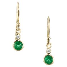 Emerald and diamond dangle earrings. 2 round rich and also bright green emeralds mounted in 18k yellow gold wire round bezel settings, accented with 2 round bezel set diamonds which sit right above the emeralds. Designed and crafted in the Peter Suchy Workshop. 2 round green emeralds, approx. .52cts 2 round diamonds, H VS approx. .5cts 18k yellow gold Tested: 18k 2.6 grams Top to bottom: 18.3mm or .72 Inches Width: 5.1mm or .20 Inches Depth or thickness: 3.3mm Please Note, we photograph each ite Gold Dangle Earrings, Diamond Dangle Earrings, Bezel Set Diamond, Gold Wire, Gold Earrings Dangle, Gorgeous Jewelry, Emerald Diamond, Bright Green, Bezel Setting