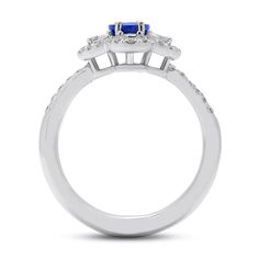 An impressive, brilliant sapphire sits at the helm of this masterfully designed ring. Four, specially cut half moon shaped diamonds are set at the north, south, east and west points of the center stone and are traced by a halo of petite diamonds. Whether it may be a gift to yourself, an engagement or wedding this jewel is a quintessential family heirloom. Metal: 18kt Gold Sapphire Weight: 0.95 ct. Half Moon Diamond Weight: 0.27 ct. Round Diamond Weight: 0.38 ct. Measurements: 14.0 mm length x 12 Celestial Style Round Diamond Ring For Formal Occasions, Celestial Style Diamond Ring For Formal Events, Celestial Style Formal Diamond Ring, Sapphire Diamond Ring With Marquise Brilliant Cut, Marquise Sapphire Diamond Ring With Brilliant Cut, Marquise Cut Sapphire Diamond Ring With Center Stone, Formal Celestial Rings With Round Cut, Celestial Style Formal Rings With Round Cut, Celestial Style Round Cut Rings For Formal Occasions