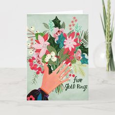 a greeting card with pink flowers and green leaves on the front that says five gold rings