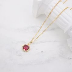 Dainty round ruby diamond halo pendant necklace. Designed and handcrafted in our Burlington Studio. ------------------------------------------------------------- PRODUCTS DETAILS Centre ruby: 7mm Pendant: 9X9mm Pendant: 14K gold plated cubic zirconia Chain and findings: 14K gold filled Total length: 16"/18"/20"/22" available from drop-down list, other length pls leave me a message for customization. Model: 18" chain ------------------------------------------------------------- SAME COLLECTION Ea Yellow Gold Teardrop Ruby Necklace, Yellow Gold Ruby Teardrop Necklace, Ruby Round Pendant Necklace In Yellow Gold, Yellow Gold Ruby Pendant Birthstone Necklace, Yellow Gold Ruby Round Pendant Jewelry, Ruby Pendant Necklace, Round Diamond Halo, Ruby Necklace Pendant, Halo Pendant