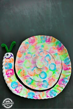 a paper plate with a snail on it