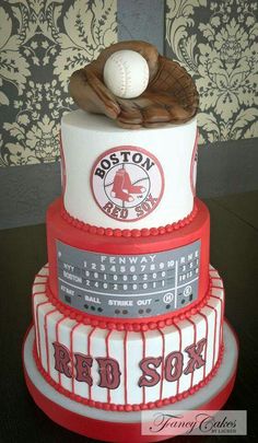 a three tiered cake with a baseball and glove on top