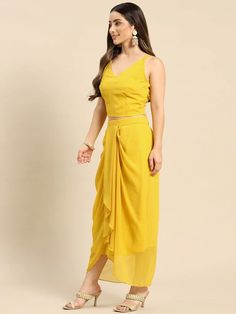 Look your absolute best as you head out this festive season wearing this Fusion Set. Crafted using the finest georgette fabric, this apparel will surely make you stand out. Complement this outfit with a pair of high-heels and chunky gold jewelry to complete your look. Material: Georgette Wash Care: Dry-clean Pattern: Printed Style: Crop Top With Dhoti Skirt Set, Crop Top With Dhoti Skirt And Jacket/Shrug Set, Dhoti Suit Set, Indo Western Dress, Indian Dress For Women Sizes: To Fit Bust(in inches Georgette Shrug, Crop Top With Dhoti, Dhoti Skirt, Ethnic Jacket, Indian Dresses For Women, Indie Dresses, Crop Top And Skirt, Style Crop Top, Dhoti Pants