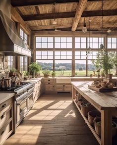 a kitchen with large windows and lots of counter space next to a stove top oven