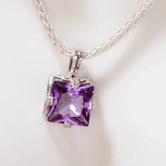 Our Alexandrite necklace displays beautiful color change in this Princess cut gemstone necklace! Our birthstone necklace is the June birthstone. This silver necklace is the perfect girlfriend gift. Alexandrite is a color changing stone, going from purple to green depending upon the light conditions. While this is minimalist in design, the size of the gemstone is a stand out and definitely makes this a statement necklace. Art Deco is the style influence. Great Birthday gift or anytime gift!The pe White Gold Amethyst Birthstone Necklace, Silver Necklaces With Accent Stones For Gifts, Gift Necklaces With Accent Stones, Sterling Silver Purple Gemstone Birthstone Necklace, Purple Sterling Silver Birthstone Necklace, Purple Gemstone Birthstone Necklace In Sterling Silver, Purple Birthstone Necklace In Sterling Silver, Amethyst Pendant Birthstone Necklace, Sterling Silver Necklace With Accent Stones For Gift