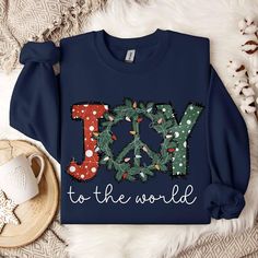 Celebrate the Season in Style with our Christmas Print Sweatshirt! Perfect for cozy holiday gatherings or a heartwarming gift, it’s the festive flair you need. Limited Edition – Grab yours before it’s gone! Holiday Graphic Print Sweater, Christmas Graphic Print Holiday Sweatshirt, Holiday Sweatshirt With Graphic Print, Holiday Letter Print Sweatshirt, Christmas Letter Print Loungewear Tops, Holiday Graphic Print Sweatshirt, Cozy Crew Neck Top For Christmas, Christmas Letter Print Tops For Loungewear, Holiday Letter Print Sweater