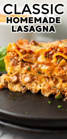 a close up of a slice of lasagna on a plate with the words classic homemade lasagna