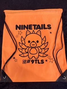 an orange drawsack bag with a cartoon character on it that says, minetails