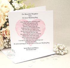 a card with a poem on it next to flowers