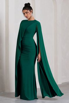 Magdelena Bottle Green Asymmetric Cape Maxi Dress – Club L London - USA Evening Maxi Dress With Sweep Train And Cape Sleeves, Green Cape Sleeves Dress For Evening, Green Cape Sleeve Evening Dress, Green Evening Dress With Cape Sleeves, Evening Green Dress With Cape Sleeves, Green Draped Evening Gown, Green Cape Dress For Party, Green Maxi Dress With Sweep Train For Gala, Elegant Green Dresses With Cape Sleeves