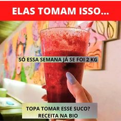 a woman holding a drink in her hand with the caption'elas tomasm is