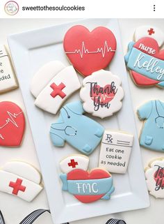 decorated cookies are arranged on a plate with the words thank you and other medical related items