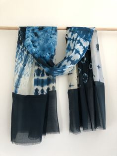 This indigo natural tie dye scarf from Ritual is made in a softly woven cotton.Perfectly sized to wear as a scarf or shawl. Product Dimensions:30"W * 74L Bohemian Cotton Scarves One Size, Bohemian Hand Dyed Scarves For Summer, Bohemian Hand-dyed Scarves For Summer, Bohemian Hand Dyed Cotton Scarves, Bohemian Hand Dyed Cotton Scarf, Bohemian Hand-dyed Cotton Scarves, Blue Casual Cotton Scarf, Casual Blue Cotton Scarves, Casual Blue Cotton Scarf