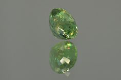 Vivid Green Demantoid Garnet. Oval Cut. 1.30 ct. - MdMaya Gems Gia Certified Oval Green Gemstones, Gia Certified Round Green Gemstones, Gia Certified Green Round Cut Gemstones, Shiny Rocks, Mali Garnet, Green Diamonds, Raw Stone Jewelry, Beautiful Gemstones, Demantoid Garnet