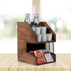 a wooden shelf with drinks and snacks in it