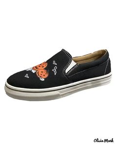 a pair of black shoes with an orange tiger on the front and white soles