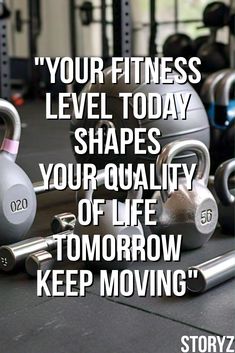 a gym with kettles and dumbbells on the floor, in front of a quote that reads your fitness level today shapes your quality of life tomorrow keep moving