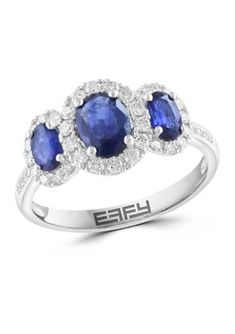 Indulge in the timeless elegance of this exquisite ring. Its lustrous 14-karat white gold band showcases an oval-cut sapphire, captivating with its deep blue hue. Accented by 42 sparkling diamonds, this ring exudes sophistication and grace. Its polished finish adds a radiant shine, making it a symbol of timeless beauty. | Effy 3/8 ct. t.w. Diamond and 1.32 ct. t.w. Sapphire Ring in 14K White Gold, 7 Formal 14k White Gold Sapphire Ring With Center Stone, Formal White Gold Multi-stone Sapphire Ring, Formal 14k White Gold Three-stone Sapphire Ring, White Gold Three-stone Sapphire Ring In Sterling Silver, White Gold Sapphire Crystal Ring, Fine Jewelry, White Gold Band, Sparkle Diamonds, Gold Band, Blue Hues