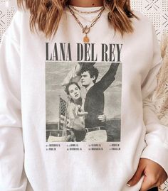 Lana Del Rey Vintage Music Sweatshirt White Screen Print Band Merch Sweatshirt, White Band Merch Sweatshirt, White Letter Print Sweatshirt For Concert, White Band Merch Sweatshirt For Concerts, White T-shirt For Concerts In Fall, White T-shirt For Fall Concert, Lana Del Rey Sweatshirt, Lana Del Rey Vintage, Lana Del Rey Merch