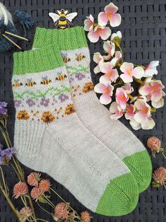 a pair of socks and some flowers on a table