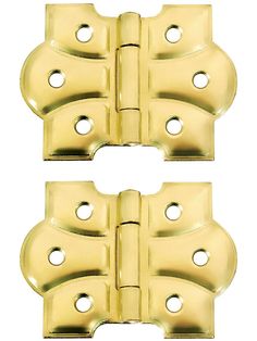 pair of brass plated cabinet door hinges