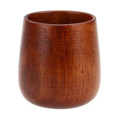 a wooden cup sitting on top of a white surface