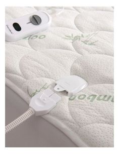 an electronic device plugged into the side of a mattress