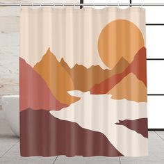 a bathroom with a shower curtain that has an image of mountains and lake on it