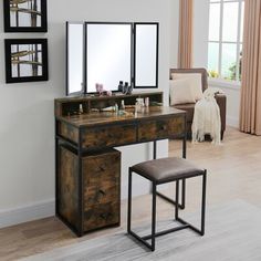 a dressing table with stool and mirror in a room