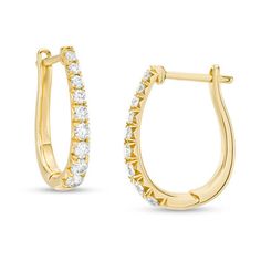 Take your dressy looks to the next level with these dazzling certified diamond hoop earrings. Created in 14K gold, each 17.0 x 12.0mm oval-shaped hoop features a row of sparkling graduated-size diamonds - the largest being 1/20 ct. stones. Each diamond boasts a color rank of H and a clarity of I1. Radiant with 1/2 ct. t.w. of diamonds and a bright polished shine, these earrings secure with hinged backs. This style arrives with a certificate that includes a photo and description of the diamonds, Formal Oval Hoop Earrings With Prong Setting, Formal Oval Hoop Earrings With Diamond Accents, Oval Hoop Earrings With Diamond Accents For Formal Events, Oval Hoop Earrings With Diamond Accents For Formal Occasions, Oval Huggie Earrings For Formal Occasions, Diamond Oval Huggie Earrings Fine Jewelry, Oval Diamond Huggie Earrings Fine Jewelry, Oval Diamond Huggie Earrings For Anniversary, Fine Jewelry Oval Huggie Earrings With Prong Setting