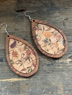 These are a pair of lightweight wood earrings with an inset of cork fabricEarrings come in 3 different sizes, small medium and large. Small - 1.5" Long 1" wide total drop length 2.25"Medium - 2" long 1.25" wide total drop length 2.75"Large - 2.5" long 1.5" wide total drop length 3.25" Wood Teardrop Earrings, Leather Jewelry Making, Wood Jewelery, Engraved Earrings, Paper Earrings, Handmade Jewelry Earrings, Painted Earrings, Cork Fabric, Expensive Jewelry