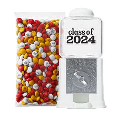 a bag of candy next to a machine with the word class of 2012 on it