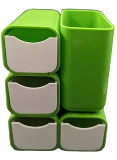 three drawers are stacked on top of each other in green and white containers with handles