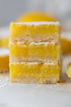 three slices of lemon cake with powdered sugar on top