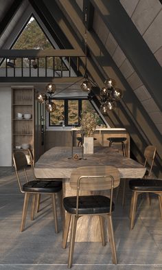 a dining room table and chairs in an attic