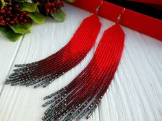 This is a long beaded earrings to the shoulders.  Such earrings are a vivid addition to the dress or summer blouse. Long earrings are becoming more popular and fashionable. It is also a great gift for someone close or for yourself. The earrings are packed in gift wrap, so they are ready for a gift. The earrings are made of Czech beads . The length of the earrings is 14,5 cm or 5,73 inches.(without taking into account the hook) Width of 2,5 cm or 1 inches. If you want a different color or size, w Red Beaded Fringe Earrings For Summer, Red Beaded Tassel Earrings For Party, Elegant Red Beaded Earrings With Fringe, Elegant Red Beaded Fringe Earrings, Elegant Summer Beaded Earrings With Fringe, Lesbian Gifts, Shoulder Duster Earrings, Fringe Earring, Beaded Earrings Native