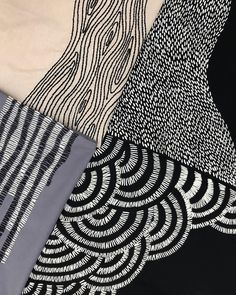 four different types of black and white fabric with wavy lines on them, all in various colors