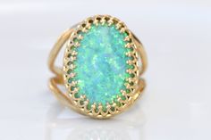 GREEN OPAL RING, Opal Gold Ring, Gemstone ring, October Birthstone, Opal Emerald lawn Gold Filled Ring, Fire Opal jewelry, Opal Big Ring Statement green opal ring made of 14k gold filled the stone is 13*18 mm , it is a perfect to give as a gift for woman Measurements: Size- available all size The center stone is 18mmx13mm Gemstone is a lab opal The ring will be packed in a gift box. FOR MY RINGS COLLECTION HERE: https://www.etsy.com/il-en/shop/rebekajewelry?section_id=14282915&ref=shopsectio Green Oval Stone Setting Rings, Green Oval Rings With Stone Setting, Oval Green Rings With Stone Setting, Elegant Green Opal Oval Ring, Green Oval Opal Ring For Formal Occasions, Green Cabochon Ring Jewelry, Unique Green Jewelry With Accent Stones, Unique Green Emerald Ring With Stone Setting, Green Emerald Ring With Stone Setting