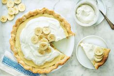 a pie with bananas and whipped cream on top